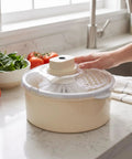 Straight Up Game Changer Electric Salad Spinner With Rapid Drain Tech That Cuts Water From Greens In Seconds on kitchen counter.