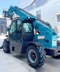 Heavy Duty Telescopic Forklift With Fast Swap Quick Hitch Setup For Effortless Pallet Handling On Rough Ground side view showcasing robust design and tires.