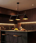 Black And Gold 3 Light Linear Kitchen Island Pendant With Adjustable Rods in modern kitchen setting