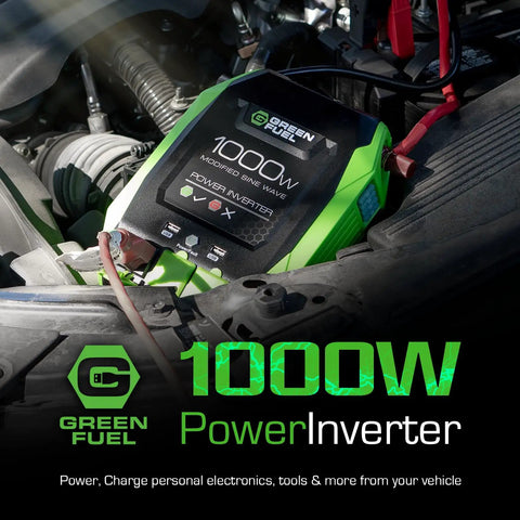 Road Ready 1000W Power Inverter 2000W Peak DC 12 Volt To AC 120 Volt Converter with green casing in vehicle engine.