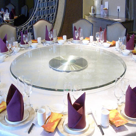 Round Tempered Glass Lazy Susan For Dining Table 31 To 43 Inch With Smooth Edges And Heavy Duty High Load Capacity Large Transparent Turntable Serving Plate For Effortless Table Service on a set dining table with napkins and glasses