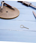 Heavy Duty Stainless Steel Eye Bolts With Nuts And Washers M10x60 on wooden surface with drafting tools.