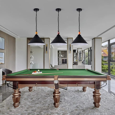 15 Inch Extra Large 3-Light Pool Table Hanging Light With Matte Metal Shades And Billiard Ball Accents, Adjustable Height, 3-Pack Pendant Lighting For Dope Game Rooms, Living Rooms, And Kitchens, Black installed above a pool table in a modern game room.