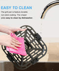 User cleaning Tough As Nails Air Fryer Grill Crisper Plate Replacement Pan for 2 Quart Mini Oven at sink.
