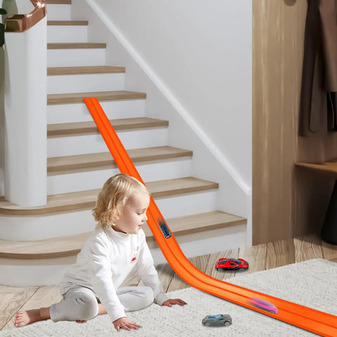 Child playing with Flexible Track Race Set For Kids With 15 Foot Modular Track, 4 Suction Cups, And Six Diecast Cars In 1 To 64 Scale