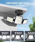 70W 7000LM LED Flood Light with 4 adjustable heads mounted outdoors showcasing angles and spread for security lighting