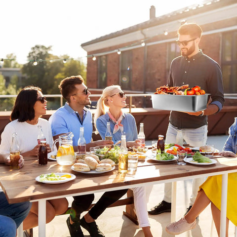 Group enjoying meal with Four Pack Full Size 6 Inch Deep Steam Table Pans Stainless Steel Serving Trays on patio