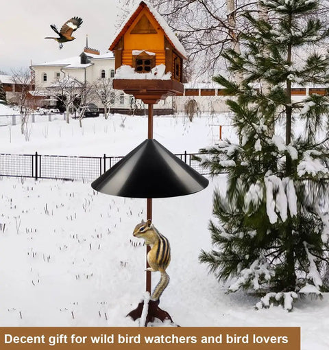 Heavy Duty Squirrel Proof Bird Feeder Baffle 19 Inch Diameter Pole Mount Shield for Outdoor Use Keeps Squirrels Off and Protects Your Feeder on a Shepherds Hook in snowy garden with bird flying