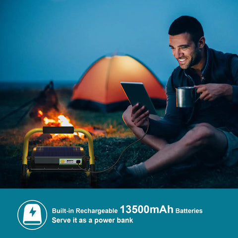 Man camping using Built Tough LED Construction Spotlight And Work Light With 8000 Lumen Brightness 13500mAh Battery Solar Or USB Recharge