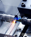 Gluwoer lathe turning tool holder in action cutting a metal shaft on a lathe with carbide insert; sparks.
