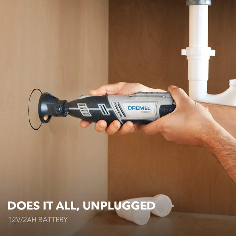 Using 12 Volt Max Cordless Rotary Tool Kit with Battery and Carrying Case in tight space for pipe cutting.