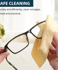 AIMI microfiber cleaning cloth for glasses; yellow cloth wiping black eyeglasses.