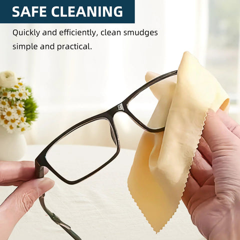 AIMI microfiber cleaning cloth for glasses; yellow cloth wiping black eyeglasses.
