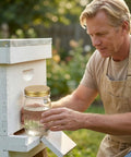 Person using Eight Pack Mason Jar Bee Feeder Lids With Perforated Metal Entrance for hive water or sugar syrup, gold finish.
