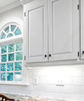 50 Pack Self Closing Cabinet Hinges Semi Overlay Half Inch Matte Black Face Frame Hinges installed on white kitchen cabinets