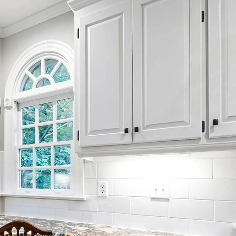 50 Pack Self Closing Cabinet Hinges Semi Overlay Half Inch Matte Black Face Frame Hinges installed on white kitchen cabinets