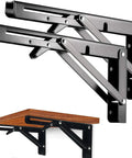 Pro Stainless Steel Folding Shelf Brackets 14 Inch Hella Solid 2 Pack Collapsible Triangle Wall Mount Hardware showing black brackets holding a wooden shelf.