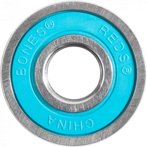 Close-up of Bones Reds skateboard bearing; turquoise inner race with metal outer ring