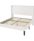 White Queen Velvet Bed Frame With Upholstered Wingback Headboard And Vertical Tufted Design Built On Heavy Duty Metal Base With Wooden Slats For Quick No Box Spring Bedroom Setup That Brings Major Style And Hits Different, side view showing slats.