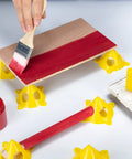 Painting wood on yellow pyramid painter stands for canvas and doors elevate your paint projects with mini cone stands