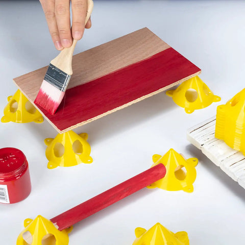 Painting wood on yellow pyramid painter stands for canvas and doors elevate your paint projects with mini cone stands