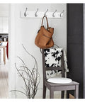 Wall Mount Wooden Coat Hooks And Rails With Zinc Alloy Entryway Organizer supporting a brown bag and jacket in a stylish entryway.