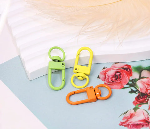 Forty Five Piece Rock Solid Metal Lobster Claw Clamps With Dope Mixed Color Combo Three Two Millimeter Slick Swivel Snap Hooks for keychain.