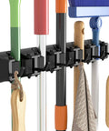Mop and Broom Holder Wall Mount Anti Slip Hanger for Cleaning Supplies Organizer with 5 Slots and 6 Hooks in use organizing tools.