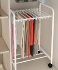 No Sweat Expandable Floor Standing Pants Hanger Trolley And Metal Garment Rack For Jeans Skirts And Trousers with hanging clothes.