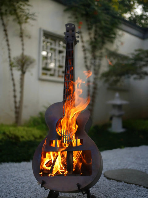 Guitar Shaped Outdoor Fire Pit Stainless Steel Wood Burning With Removable Ash Pan Stand And Carry Bag For Patio Yard Camping Garden Picnic And Bonfire Heating, flames visible in guitar design.