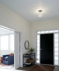 Foyer with Winslow 8.5 Inch Brushed Nickel Semi Flush Mount Light With Clear Seeded Glass illuminating entryway.
