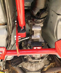 Torque Arm Relocation Kit For 1982 To 1992 Camaro And Firebird TH400 Automatic Transmission Red Short Tail TH400 With 4 Inch Tailshaft For Beefed Up Muscle Car Handling installed under chassis