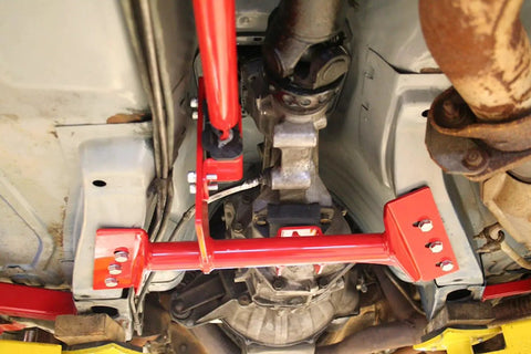 Torque Arm Relocation Kit For 1982 To 1992 Camaro And Firebird TH400 Automatic Transmission Red Short Tail TH400 With 4 Inch Tailshaft For Beefed Up Muscle Car Handling installed under chassis