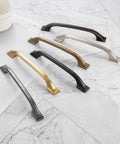 Array of 10 Pack 3 Inch Oil Rubbed Bronze Cabinet Pulls For Kitchen Cabinets Drawers Dressers Cupboards Solid Metal Hardware With Smooth Rounded Edges For Easy Grip And Cool Modern Look displayed on marble surface with various finishes