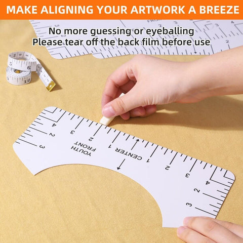 Hands using a ruler from the T Shirt Alignment Tool Set, Handy Vinyl Heat Press Kit With Eight Rulers, Soft Measuring Tape, Forty Color Pins, And Front Back Ruler Design For Round And V Neck Cuts, PVC Vinyl Heat Press Accessories For Adult, Youth, And Children on yellow fabric.