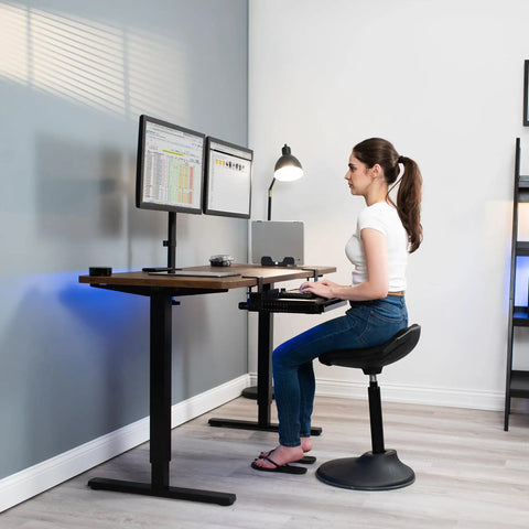 Woman using Under Desk Keyboard Tray With Pull Out Platform Extra Sturdy C Clamp Mount Big 33 Inch Wide By 11 Inch Deep Slide Out Tray