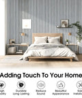 Premium Wood Slat Acoustic Panels Feature Heavy Duty Sound Absorption Tech Ideal For Epic Gaming Room Accent Walls And Home Theater Backdrops Available In Clean White Marble Finish To Hella Level Up Your Space on a stylish wall behind a bed.