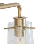 Close-up of Soft Gold 4 Light Vanity Fixture with Seeded Glass Shade 31 Inch Modern Chic Bathroom Lighting Bar gold finish detail