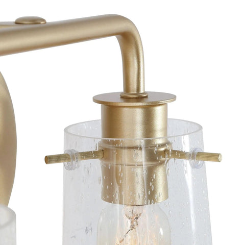 Close-up of Soft Gold 4 Light Vanity Fixture with Seeded Glass Shade 31 Inch Modern Chic Bathroom Lighting Bar gold finish detail