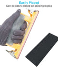 Gloved hand using sanding block with sheet from All Purpose Pro Grade Sandpaper Kit DIY Friendly with 48 Pcs Wet Dry Sheets 16 Grits 120 to 5000.