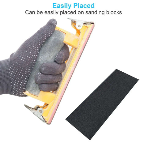 Gloved hand using sanding block with sheet from All Purpose Pro Grade Sandpaper Kit DIY Friendly with 48 Pcs Wet Dry Sheets 16 Grits 120 to 5000.