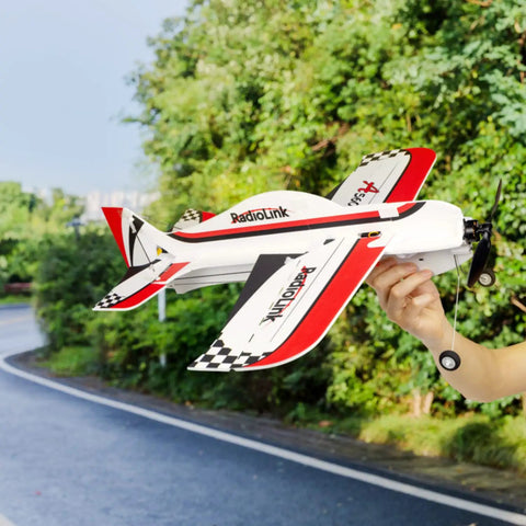 Hand holding model airplane, Rock Solid 2.4GHz RC Receiver For Drone And Fixed Wing, 6/10 Channel SBUS PWM PPM Outputs visible.