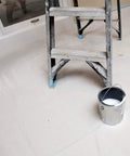 Ladder and paint can on Heavy Duty 10 Ounce Canvas Drop Cloth 6 Feet By 9 Feet Tan 54 Sq Ft Contractor Grade for painting
