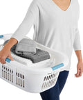 Person carrying Hip Hugger Laundry Basket With Easy One Hand Carry Grip One And A Half Bushel White Hamper Lightweight Stackable Organizer