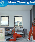 Person playing air guitar with vacuum next to Clean Fairy vacuum bag in living room.