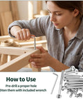 Person using hex key from All In One 121 Piece Furniture Hardware Kit with M6 bolts and cam locks for assembly on wooden frame