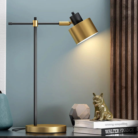 Mid Century Modern Desk Lamp With Matte Black Finish And Gold Accent, Sleek 22.25 Inch Metal Table Light illuminating on nightstand