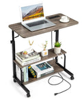 Unwind And Handle Daily Grind At This Grey Oak Rolling Standing Desk With Height Adjustable Top Smooth Gliding Wheels Grab And Go Mobility Side Hooks And Roomy Storage Shelves For Your Home Office Setup with laptop and storage shelves.