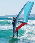 Man using Inflatable Paddle Board Sail Handheld Windsurfing Sail With 360 Degree Rotating Base on ocean waves, 3.2 square meters.