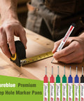 Premium Long Nib Markers And Deep Hole Marker Pens Waterproof Construction Marking Tools With Built In Ruler in use measuring a wooden board.